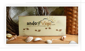 AndoDeViaje.com logotipo con adornos de playa